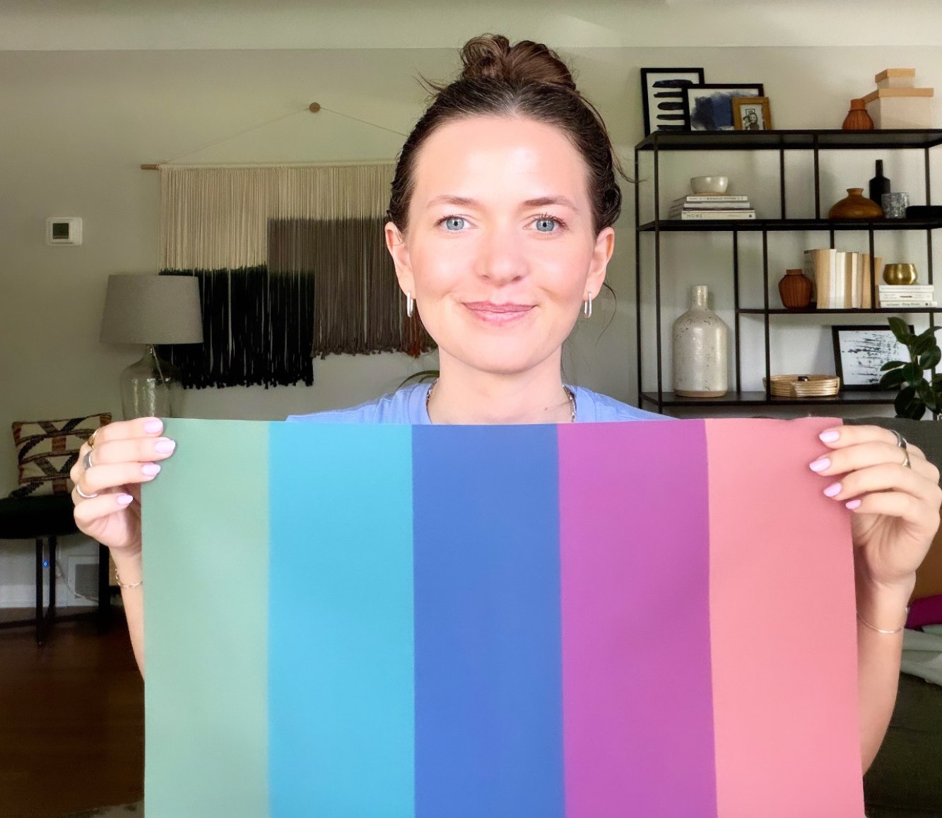 Nicole holding a Soft Summer drape in The Stylery's studio