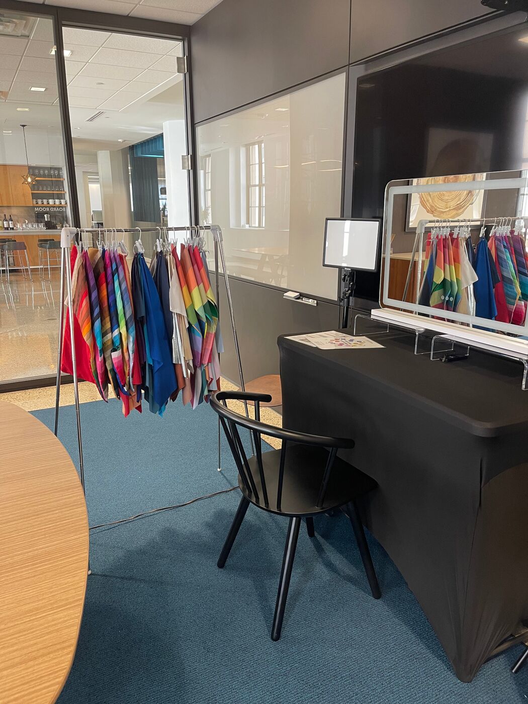 Portable color analysis station with drape rack and lighting set up in an office