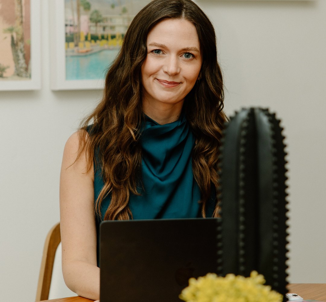 Nicole at her desk in the studio