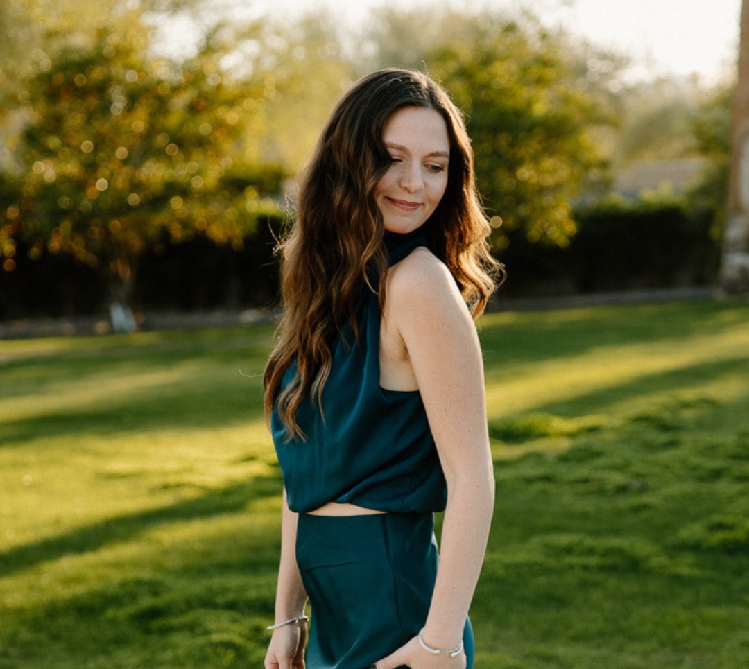 Nicole in a soft teal satin outfit